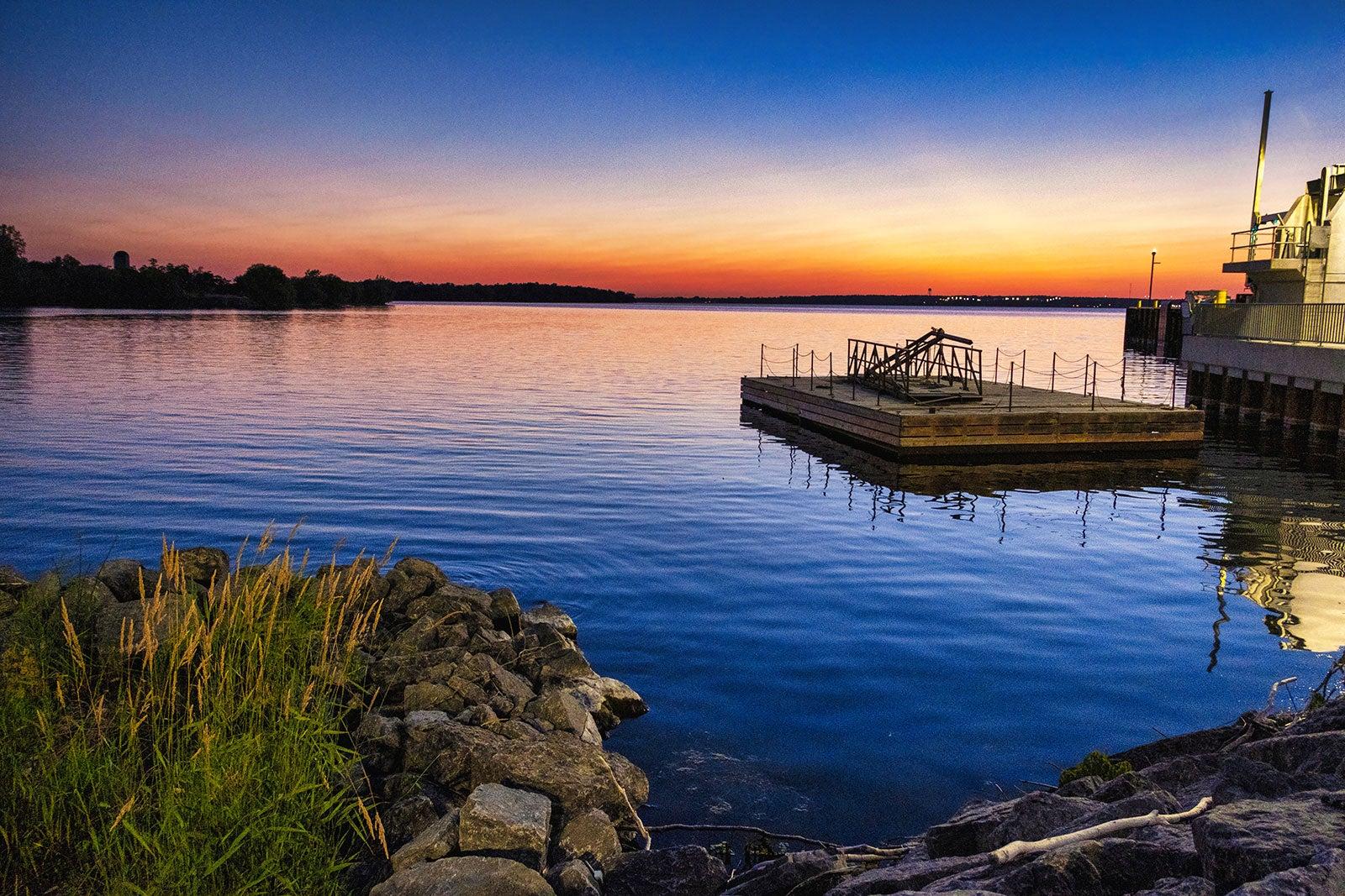 A body of water at sunset.