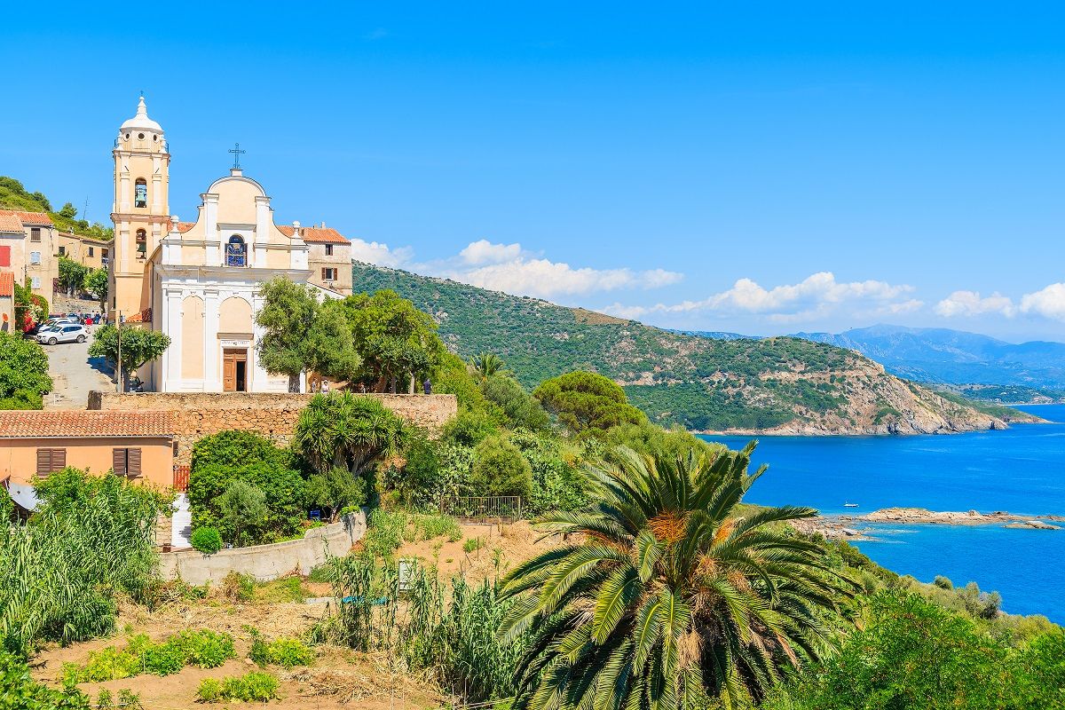 A Corsican village, sea in the background.