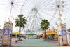 The entrance to Nagoya Port Sea Train Land with a large Ferris wheel in the background