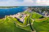 Aerial view of old fort along the water.