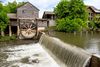 Water flowing and a wooden mill.
