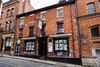 photo by <a href="https://commons.wikimedia.org/wiki/File:Stone_Roses_Bar_4_King_Street_York_02.jpg " target="_blank" rel="noreferrer">Malcolmxl5</a> (<a href="https://creativecommons.org/licenses/by-sa/4.0/" target="_blank" rel="noreferrer">CC BY-SA 4.0</a>) modified