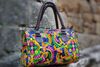 photo by <a href="https://www.maxpixel.net/Floral-Ornament-Fashion-Luggage-Bags-Women-1225289" target="_blank" rel="noreferrer">Max Pixel</a> (<a href="https://creativecommons.org/share-your-work/public-domain/cc0/" target="_blank" rel="noreferrer">CC0</a>) modified