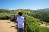 A young person watching the hills of Crystal Cove State Park.