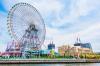 A view of the Ferris wheel and roller coaster on the water at Yokohama Cosmo World in Tokyo.