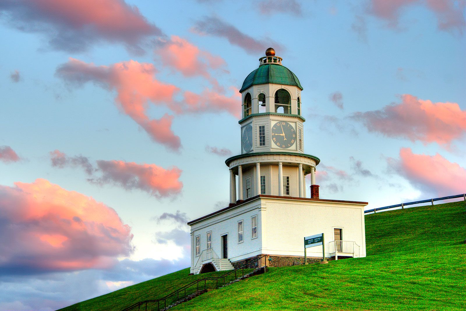 A clock tower at sunrise.