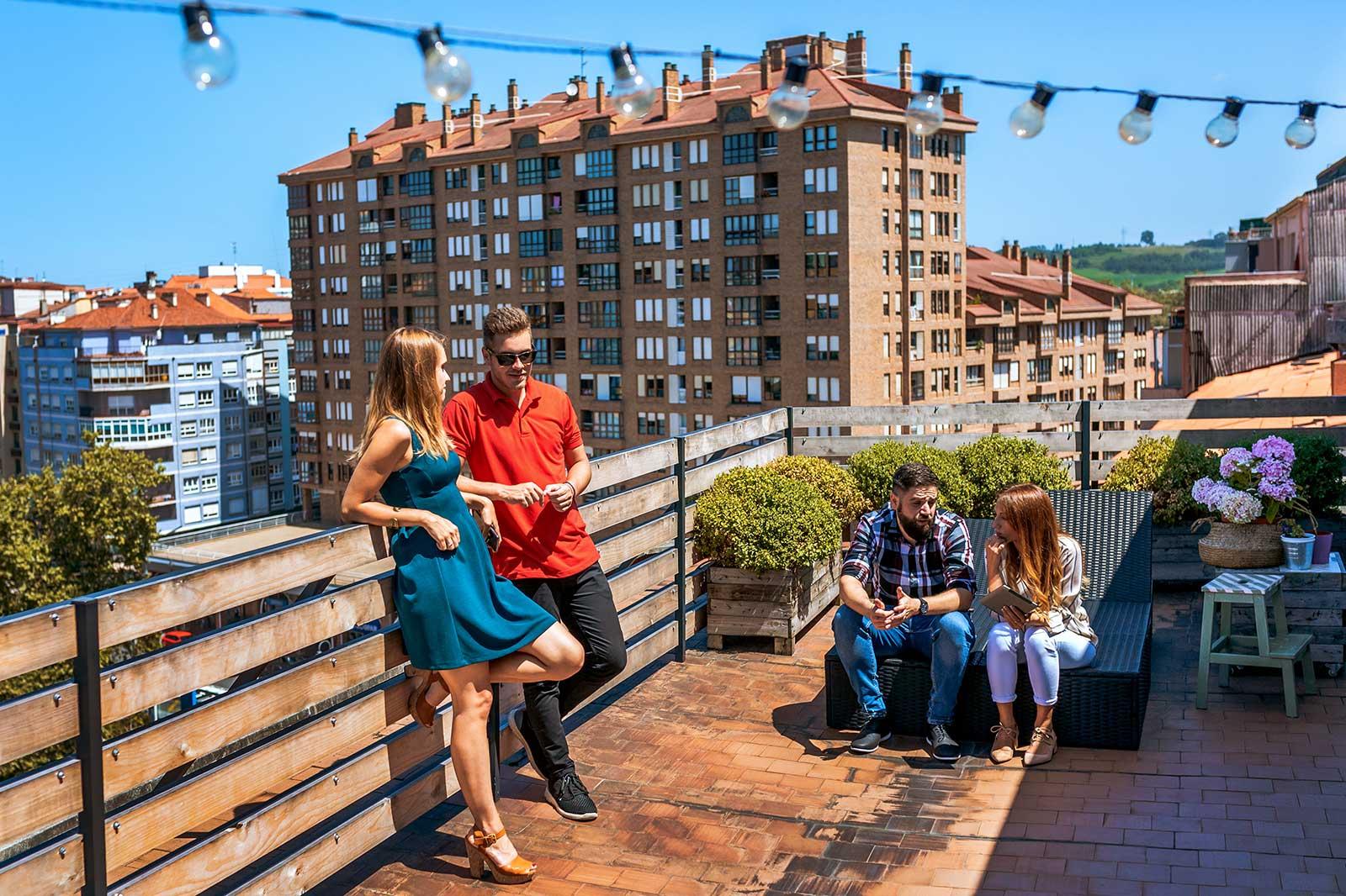 People chilling on a rooftop.