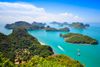 An aerial view of rainforest, sea and islands.