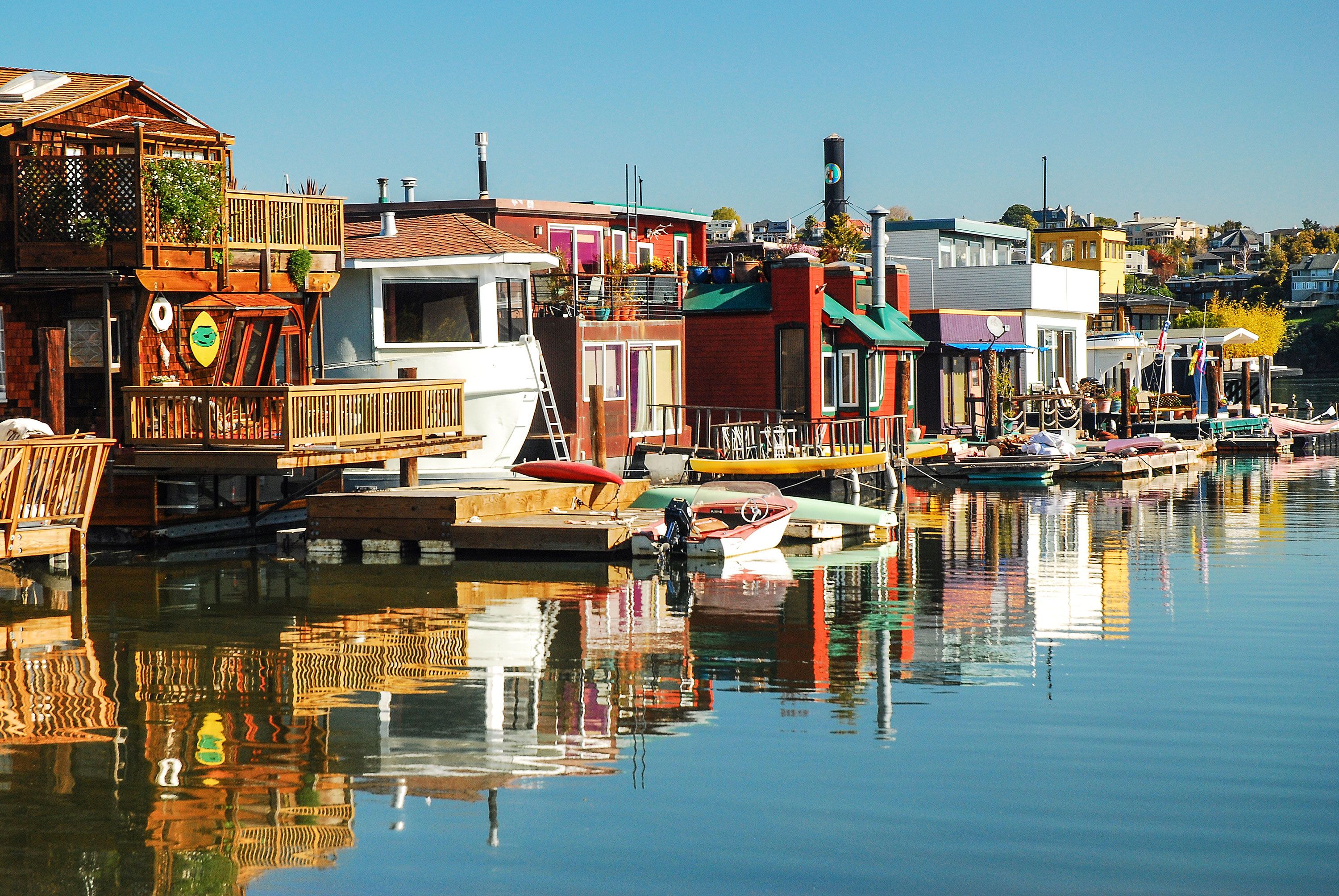 Brightly colored houseboats line the water front of Sausalito, California.