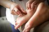 Acupressure treatment being applied to the feet.