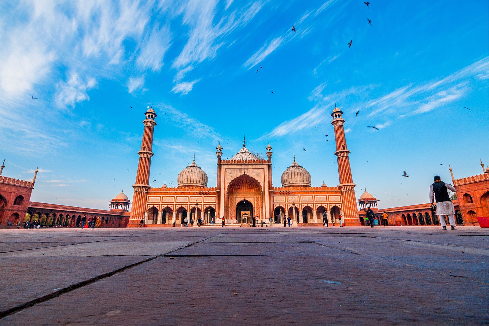 A large sandstone colored mosque.
