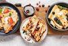Plates with different variety of crepes.