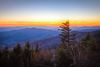 Mountains and trees at sunset.
