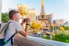 A man taking a photo of the strip in Las Vegas, NV.