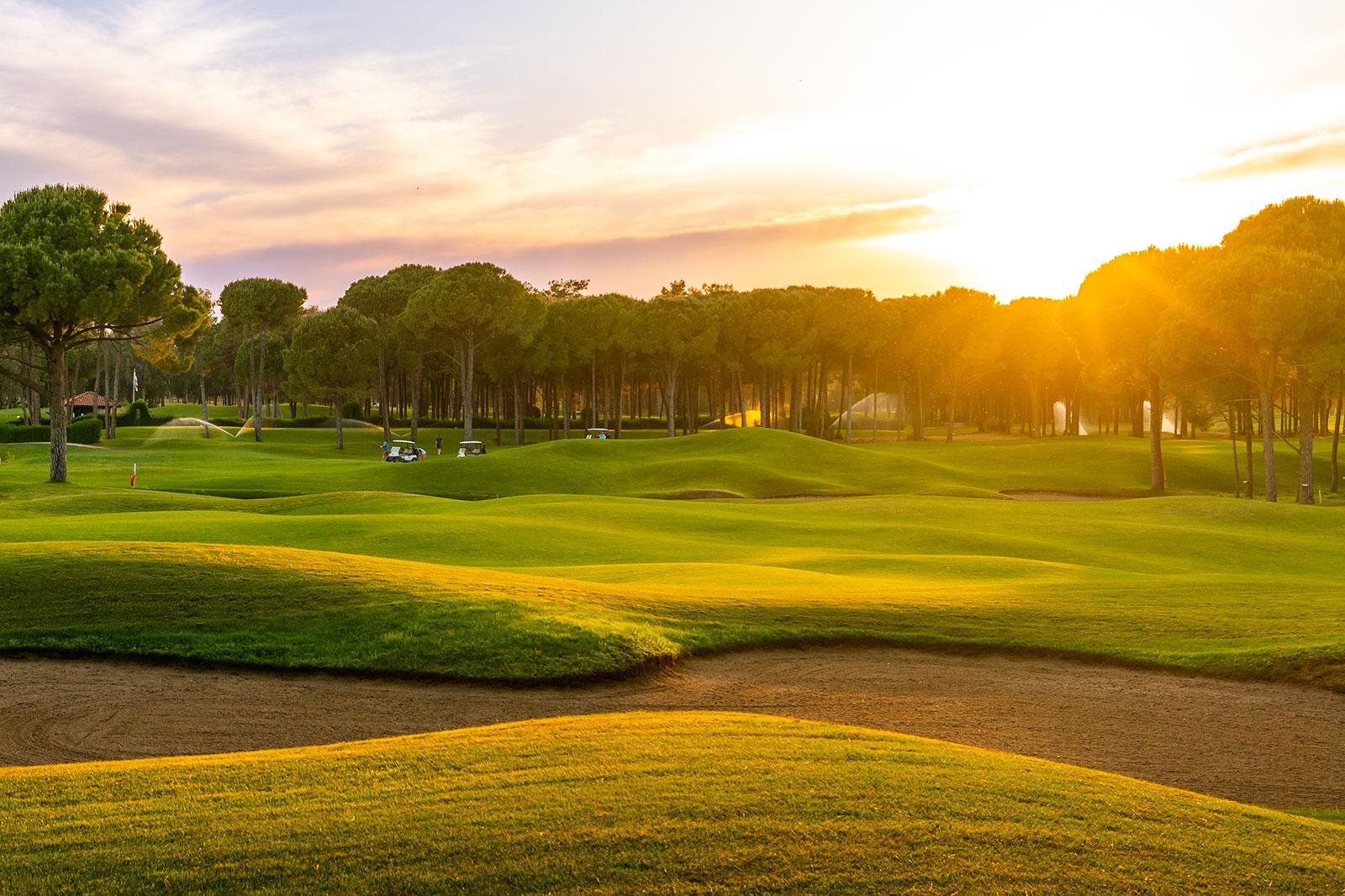 A sunset at a golf course.