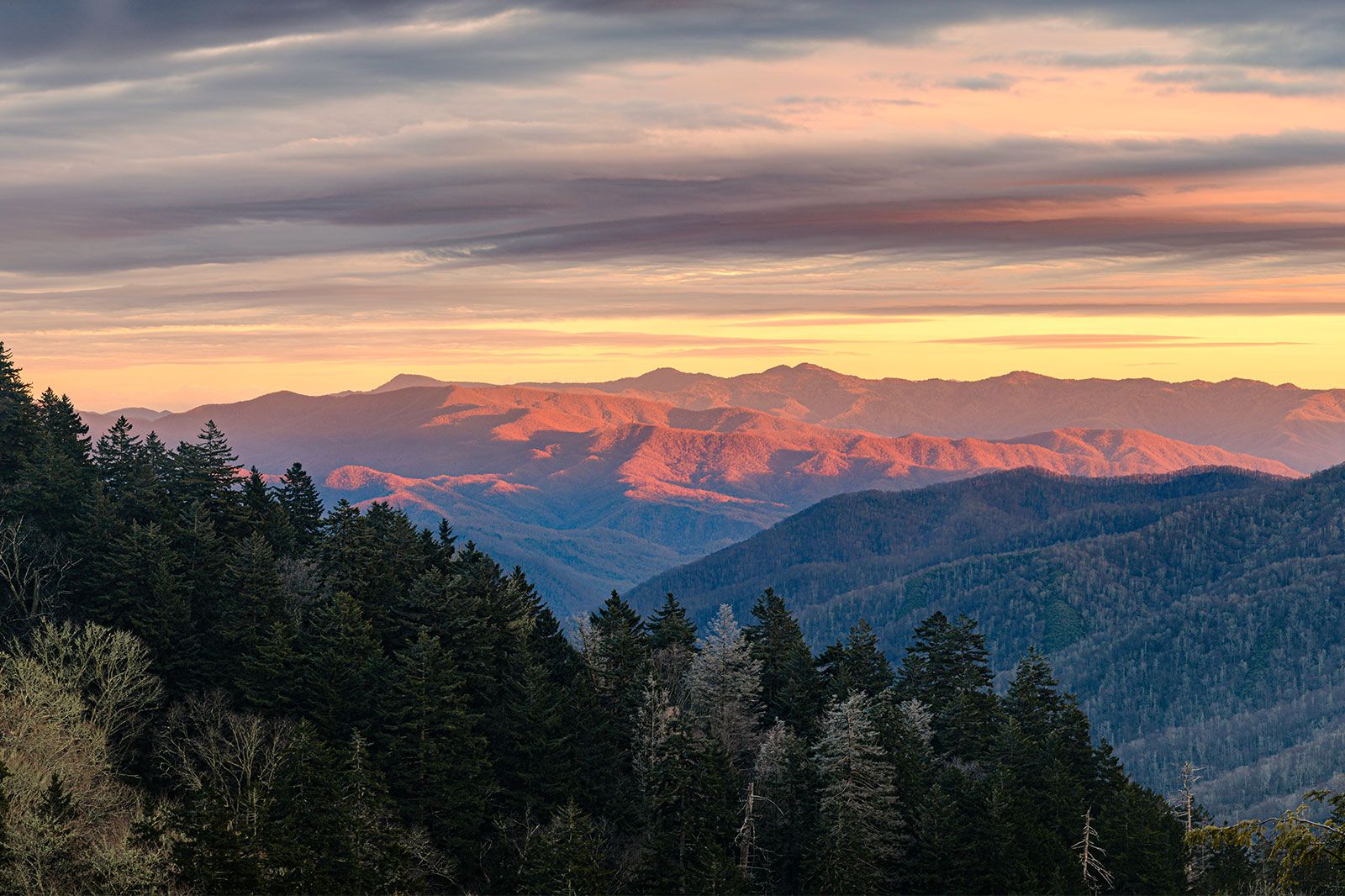 A sunset over the vast mountains.