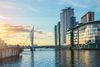 A bridge over water in a city