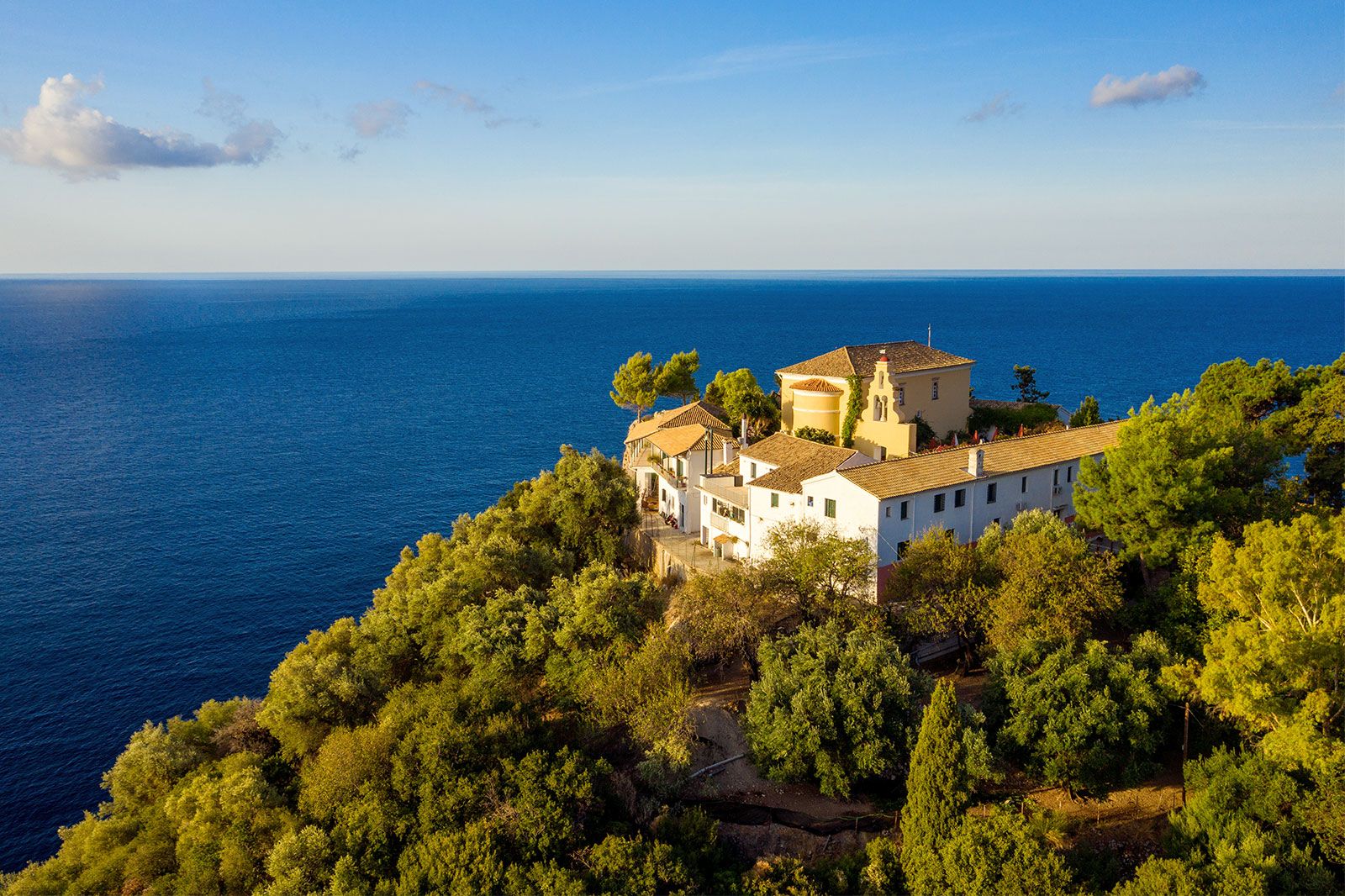 Aerial view of a greek monastery on a mountain hill.