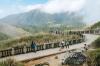 People posing for photo on a walkway overlooking the mountains in Yangmingshan Nation Park in Taipei.