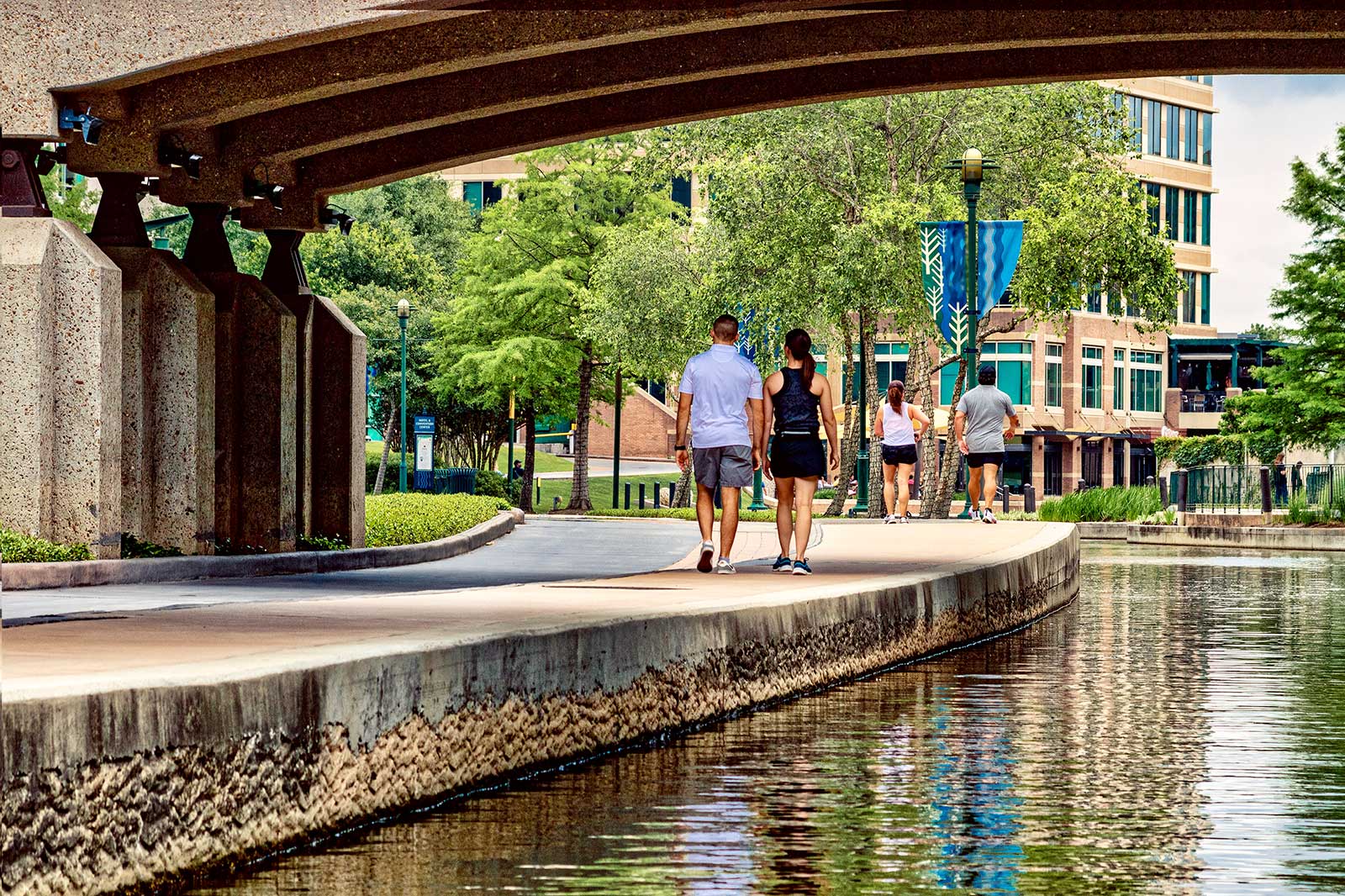 A walkway by a canal.