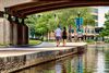 A walkway by a canal.