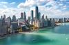 City skyline of Chicago and Lake Michigan on a cloud-filled sunny day.