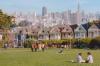 The colourful Edwardian houses, or "Painted Ladies," of Alamo Square overlook the park with the San Francisco skyline visible beyond