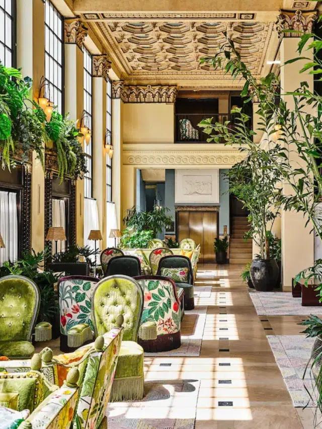 Sunlight pours into the colorful lounge area at Hotel Per La in Los Angeles, California