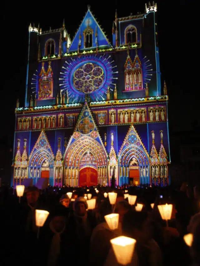 The colorfully lit Cathédrale Saint-Jean-Baptiste during the Fête des Lumières, Lyon, France