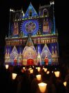 The colorfully lit Cathédrale Saint-Jean-Baptiste during the Fête des Lumières, Lyon, France