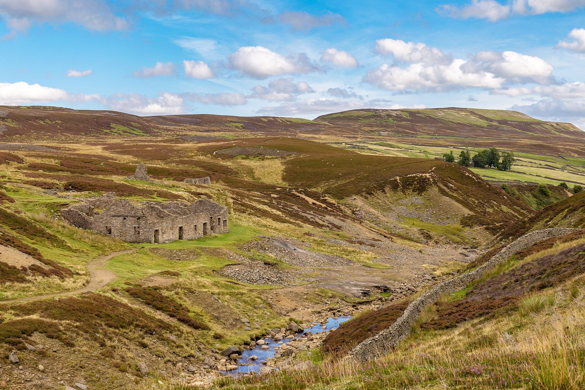 A landscape with the ruins of the Surrender Smelt Mill in North Yorkshire, England.