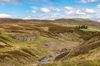 A landscape with the ruins of the Surrender Smelt Mill in North Yorkshire, England.