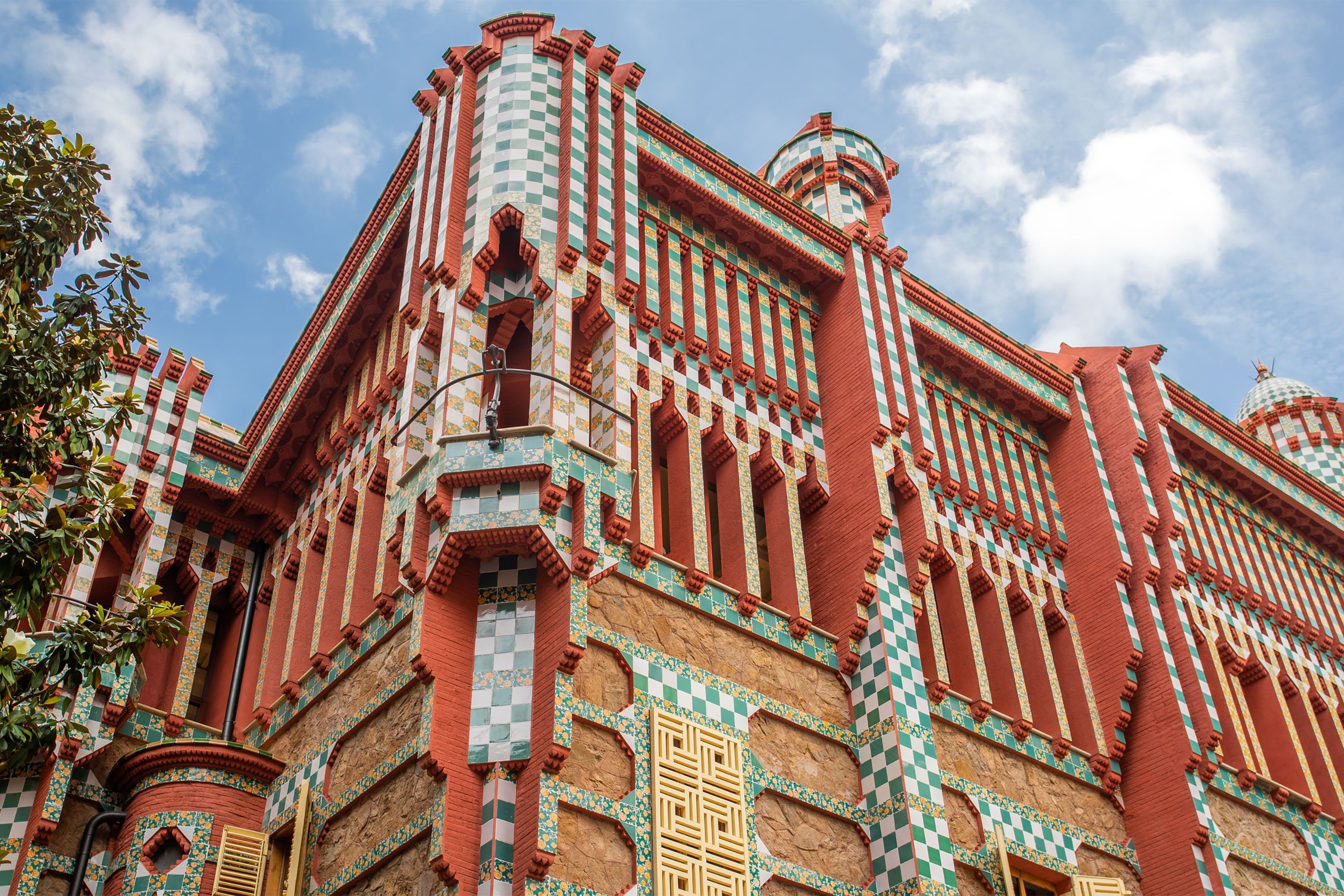 Exterior view of Casa Vicens in Barcelona, featuring colorful tiles, ornate ironwork, and Gaudí’s signature modernist architectural style.