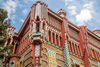 Exterior view of Casa Vicens in Barcelona, featuring colorful tiles, ornate ironwork, and Gaudí’s signature modernist architectural style.