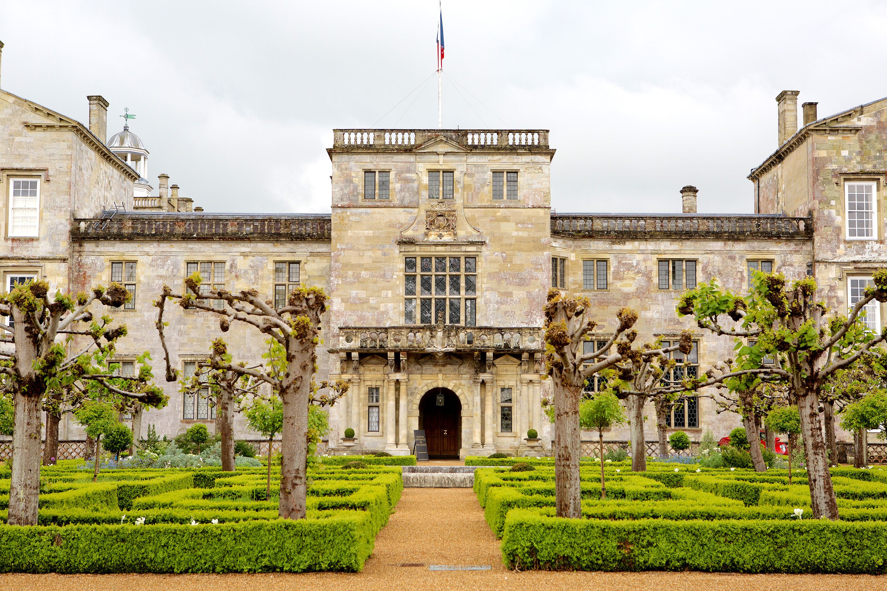 Gardens welcome you to a large estate.