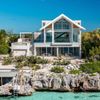 A large waterfront Vrbo in Turks & Caicos, with steps into clear turquoise water