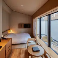 A bright, wooden-clad bedroom at Onsen Ryokan Yuen Bettei Tokyo Daita hotel in Tokyo, Japan