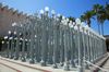 A group of street lamps clumped together on a sidewalk in Los Angeles.
