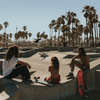 Skaters on a sunny day at the Venice Beach Skatepark in Los Angeles, California