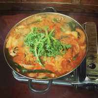 A steaming pan of food on a hotplate at Chunju Han-Il Kwan in Koreatown, Los Angeles