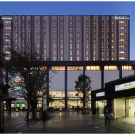 The illuminated building of the Richmond Hotel Premier Tokyo Schole in Tokyo, Japan