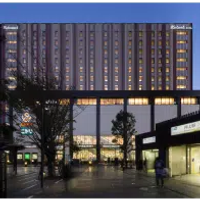 The illuminated building of the Richmond Hotel Premier Tokyo Schole in Tokyo, Japan