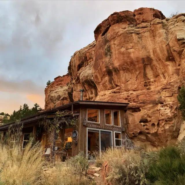 Exterior view of Cliff House, a cottage built into built into the sandstone of Sage Canyon in Colorado