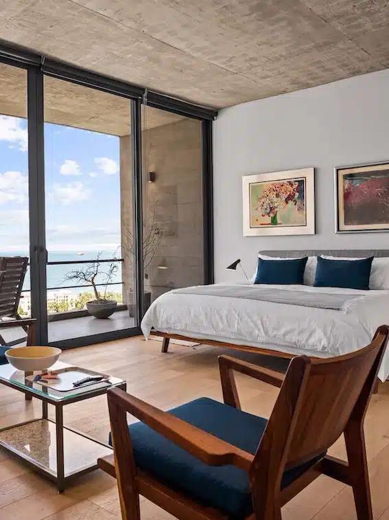 A stylish bedroom of a Vrbo with sea views