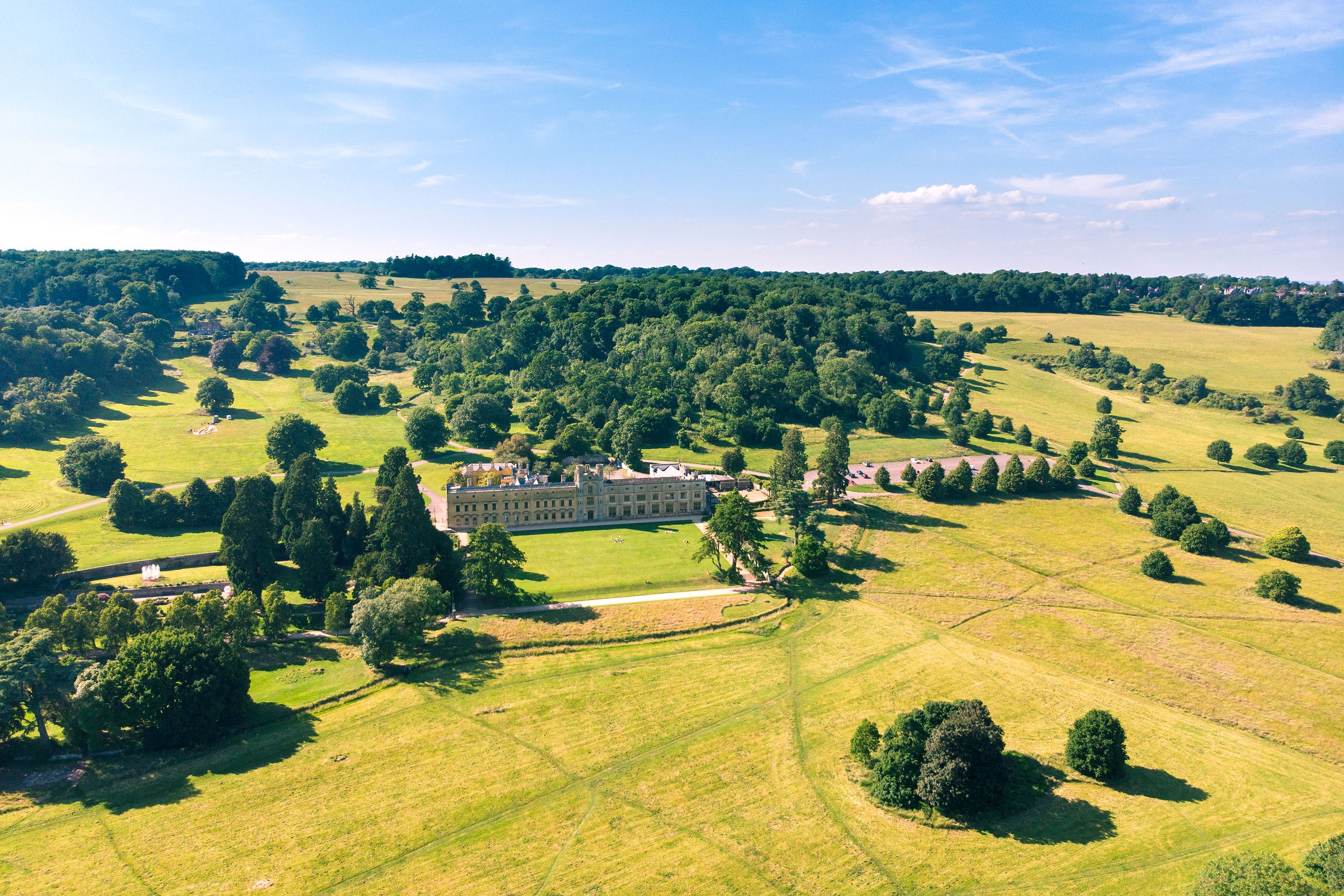 Aerial view of Ashton Court manor house and estate in Bristol countryside.