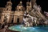 A close-up of the Fontana dei Quattro Fiumi in Piazza Navona in Rome, Italy in night.