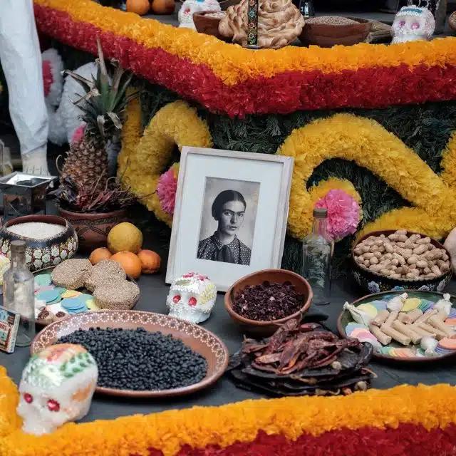Altars are lined with food, flowers, photos and sentimental objects