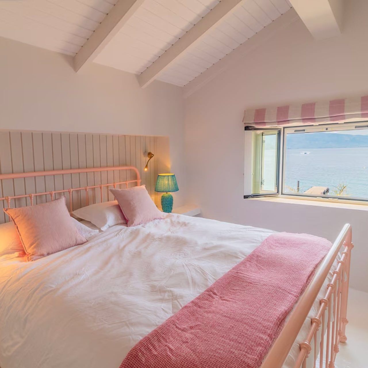 A pretty bedroom in Greece decorated in tonal shades of pink
