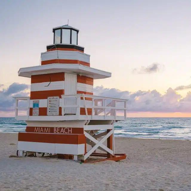 A red and white retro-style lifeguard station on Miami Beach