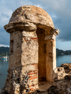 An old heritage structure stands before the ocean in Portobelo in Panama